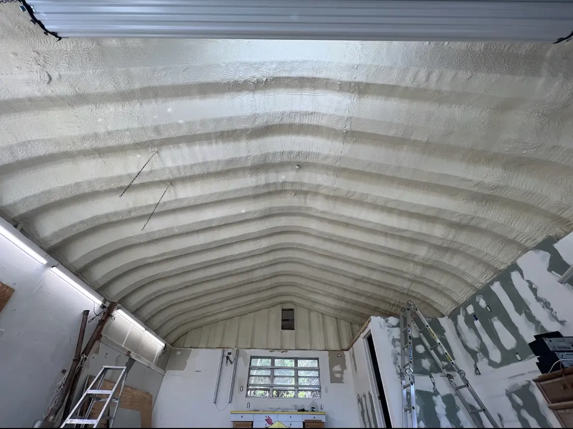 Spray polyurethane foam applied to the underside of a metal roof deck in Ashburnham